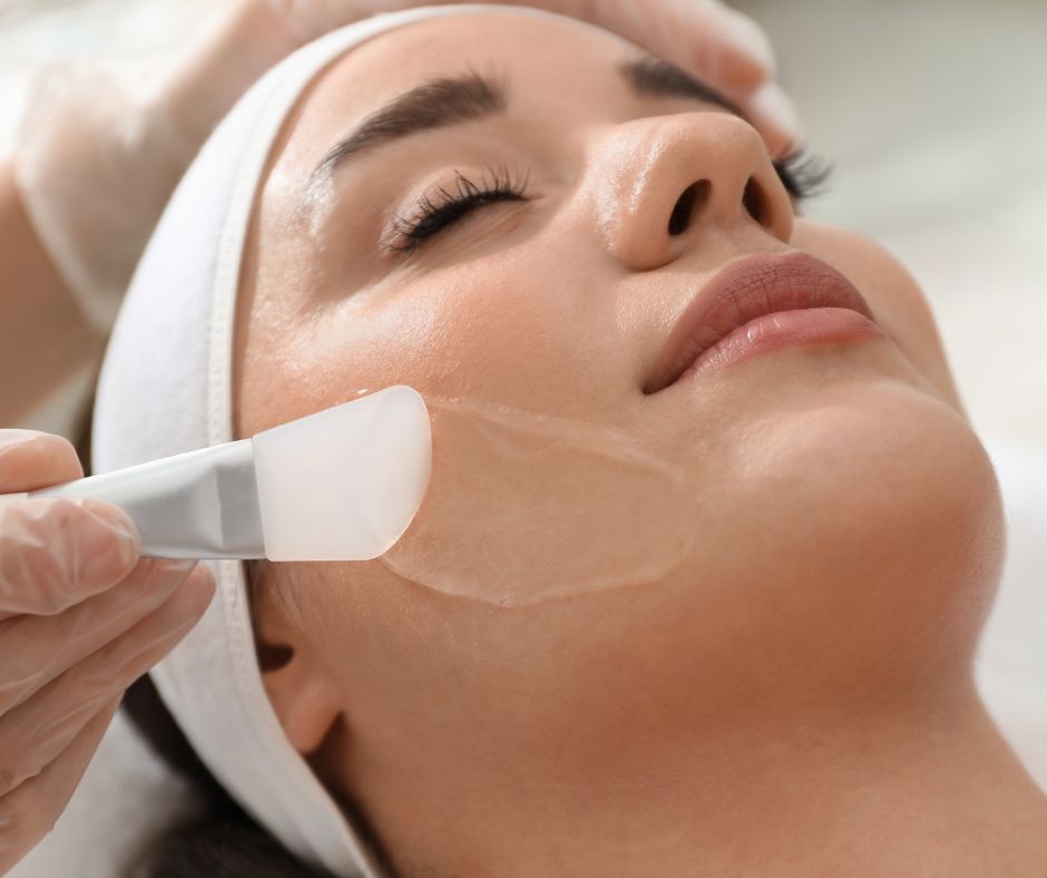 woman undertaking skin treatment